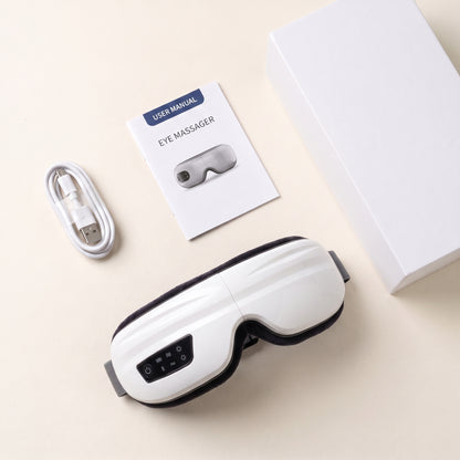 What is included with the Velto Heated Eye Massager — device, USB cable, manual and a white gift box
