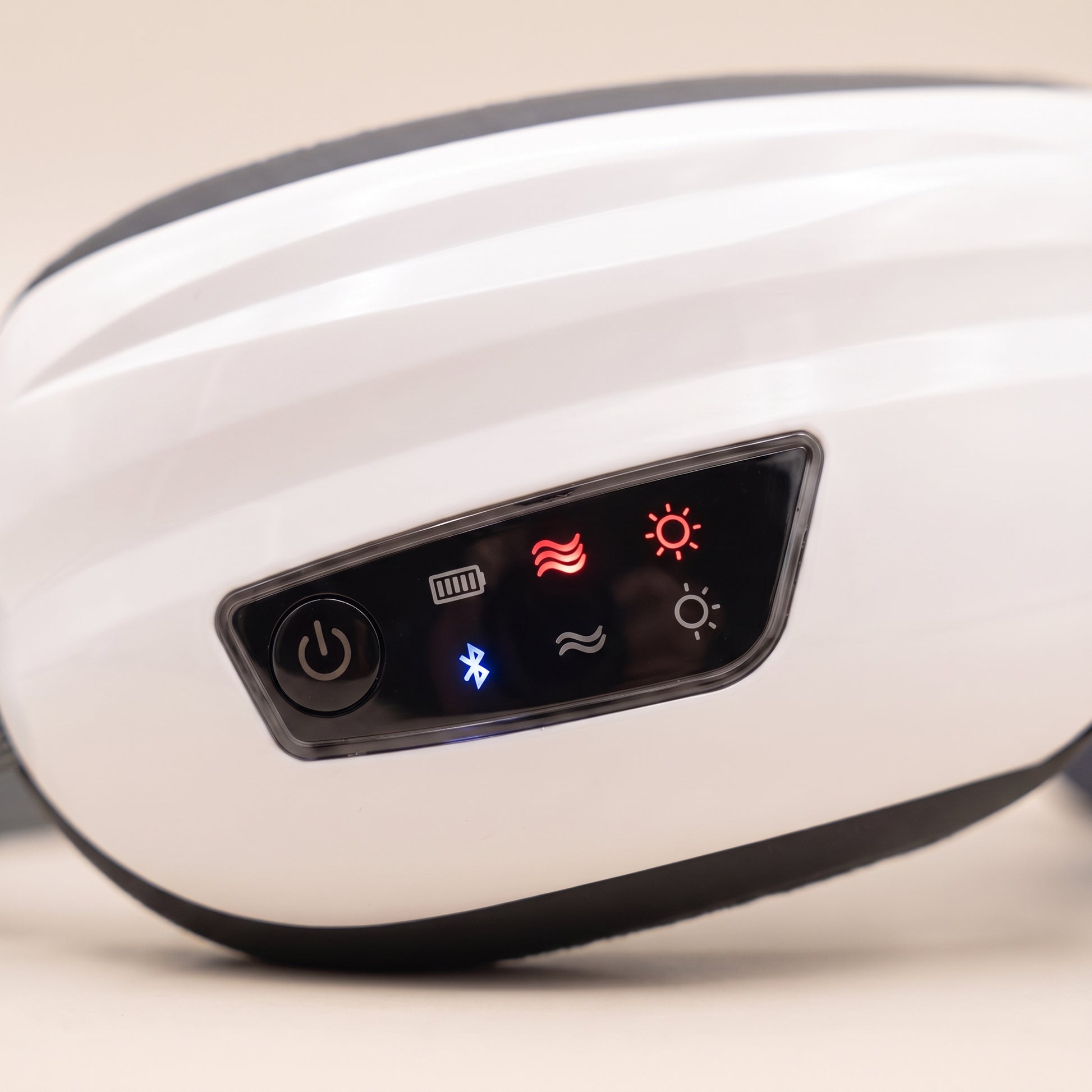 Close-up of the Velto Heated Eye Massager control panel