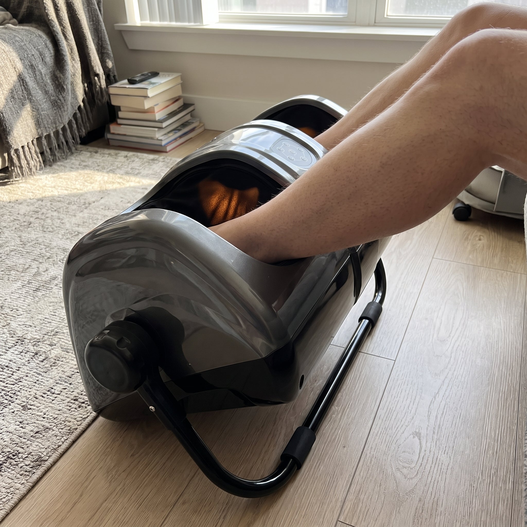 The Velto foot and calf massager tilted up on its bracket to massage the calves