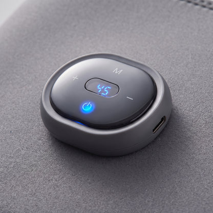 Close-up of the Velto Heated Knee Massager's detachable control unit with the display lit